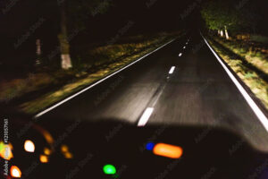 Driving at night dark two lane road